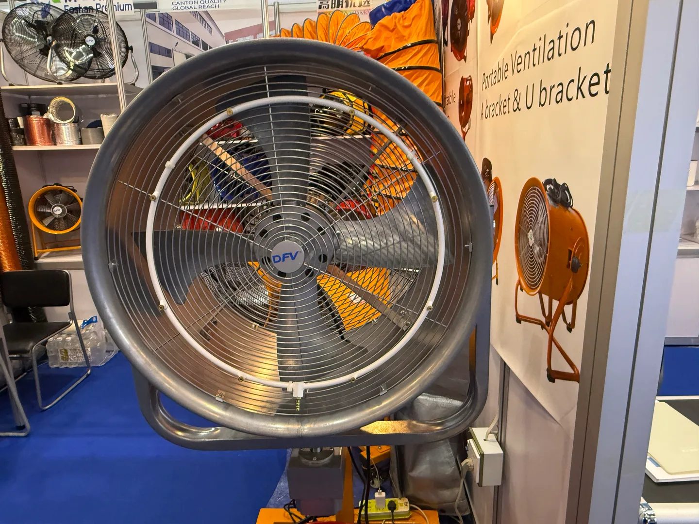 Large fan with a circular protective grille at a ventilation equipment booth
