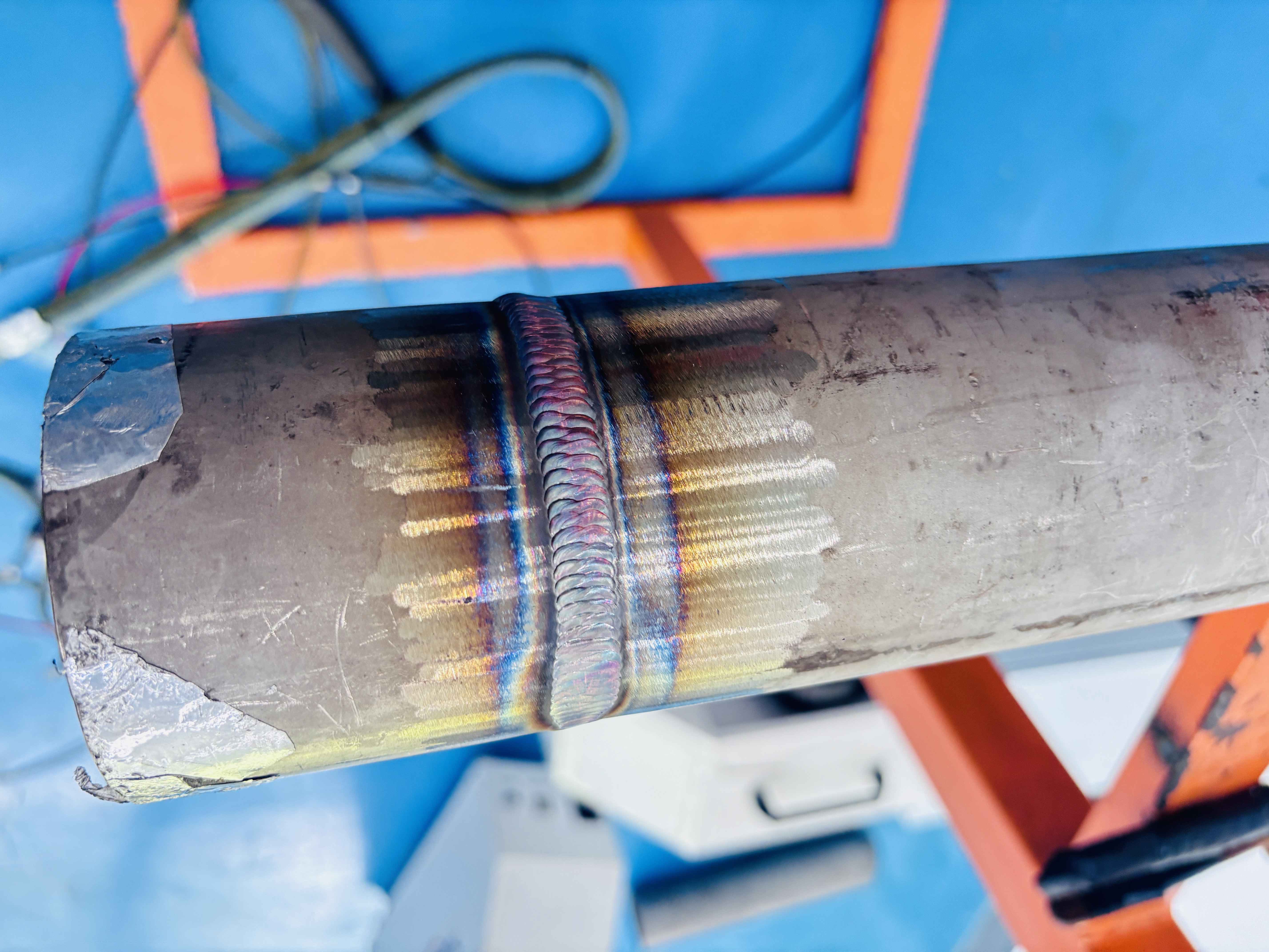 Close-up of a pipe weld photographed during the on-site machine testing visit